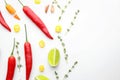 Composition with fresh chili peppers and herbs on white background Royalty Free Stock Photo