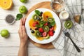 Composition fresh fruit salad on white wooden table, top view Royalty Free Stock Photo