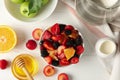 Composition fresh fruit salad on white wooden table, top view Royalty Free Stock Photo