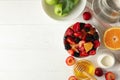 Composition fresh fruit salad on white wooden table, top view Royalty Free Stock Photo