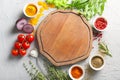 Composition with fresh herbs, spices and wooden board on textured background Royalty Free Stock Photo