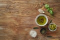 Composition with fresh olive oil on wooden table Royalty Free Stock Photo