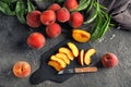 Composition with fresh peaches on grunge table Royalty Free Stock Photo