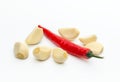 Composition with fresh peeled garlic, red chili pepper isolated on white background. Health concept Royalty Free Stock Photo