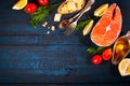 Composition with fresh salmon, herbs, parmesan and spices. Food background. Space for text Royalty Free Stock Photo