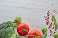 Composition of fresh vegetables with a copy of the space. green broccoli. red tomato and Savoy cabbage. theme useful and healthy Royalty Free Stock Photo