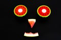 Composition of a funny face made with fruit, smile of a watermelon for summer diets