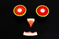 Composition of a funny face made with fruit, smile of a watermelon for summer diets Royalty Free Stock Photo