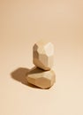Composition of geometric balancing wooden stones. Concept of balance. Pastel background with copy space
