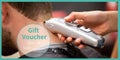 Composition of gift voucher text over female hairdresser giving caucasian man haircut Royalty Free Stock Photo