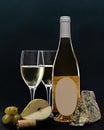 Composition with glass and bottle of white wine with blue mold cheese, pear and grapes on grey background. copy space Royalty Free Stock Photo