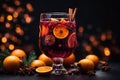 Composition with a glass of hot mulled red wine with spices. Holiday atmosphere, christmas ligths on background Royalty Free Stock Photo