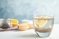 Composition with glass of water and chia seeds on table against color background Royalty Free Stock Photo