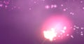 Composition of glowing clusters of pink light energy and stars on dark pink background