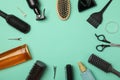 Composition hairdresser accessories on mint background, top view Royalty Free Stock Photo