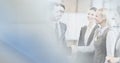 Composition of happy diverse business team shaking hands with motion blur Royalty Free Stock Photo