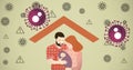 Composition of happy parents holding baby under roof, with covid cells and warning signs, on green