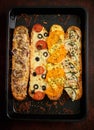 Composition of hot tasty baked sandwiches with various toppings. Cheese, tuna, mozarella, spices