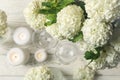 Composition hydrangea flowers on wooden background, top view. Romantic evening