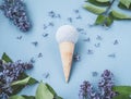 Composition of ice cream cone with bath ball on a blue background Royalty Free Stock Photo