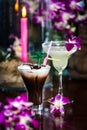 Still life with Iced coffee with cream, orchid flowers, burning Royalty Free Stock Photo