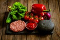 Composition of ingredients for beef black burger on a black stone board. Black burger Royalty Free Stock Photo