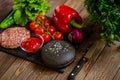 Composition of ingredients for beef black burger on a black stone board. Black burger Royalty Free Stock Photo