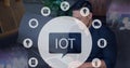 Composition of iot icon with network of connections over man using tablet Royalty Free Stock Photo