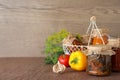 Composition with jars of tasty pickled vegetables on brown table. Royalty Free Stock Photo