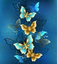 Composition with jewelry butterflies on blue background