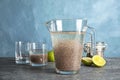 Composition with jug of water and chia seeds on table against color Royalty Free Stock Photo