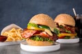 Composition with juicy bacon burger on grey Royalty Free Stock Photo