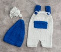 Composition of knitted suit and hat Royalty Free Stock Photo