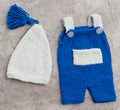 Composition of knitted suit and hat Royalty Free Stock Photo