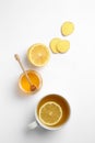 Composition with lemon tea, honey and ginger on white background Royalty Free Stock Photo