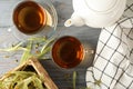 Composition linden tea on wooden background, top view. Natural tea Royalty Free Stock Photo
