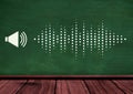 Composition of loudspeaker symbol and sound frequency dot level meter on green wall over wood floor