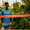 Composition of make a difference day text over biracial male volunteer segregating waste Royalty Free Stock Photo