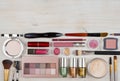 Composition of makeup products and cosmetics on table with copyspace