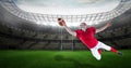 Composition of male american football player catching ball at stadium Royalty Free Stock Photo