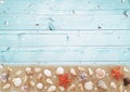 Composition of many exotic seashells different shape, red starfish, pearls, confetti, stars on the sand. Summer marine concept on
