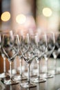 Composition of many wine glasses on party table. Beatiful set of glassware with soft bokeh Royalty Free Stock Photo