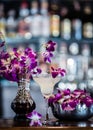 Still life with margarita cocktail and orchid flowers in the bar Royalty Free Stock Photo