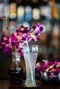 Still life with margarita cocktail and orchid flowers in the bar Royalty Free Stock Photo