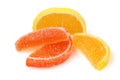 Composition of marmalade candy in shape of citrus fruits wedges. Yellow and orange Jelly sweet candies isolated on white Royalty Free Stock Photo