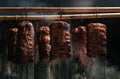 Composition of meats. Traditionally smoked ham. Hanging ham in the smokehouse smoked bacon for smoking. Long banner format