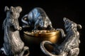 Composition from metal figures: rats are fighting for a piece of cheese. Products from silver and gold. The concept of the zodiac