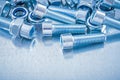 Composition of metal nuts and screwbolts on