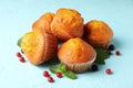 Composition with muffins and berries on blue background close up Royalty Free Stock Photo
