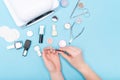 Composition for nail care, female young hands, French manicure, gel polish, lamp for nails and equipment for nail care. Flat lay p